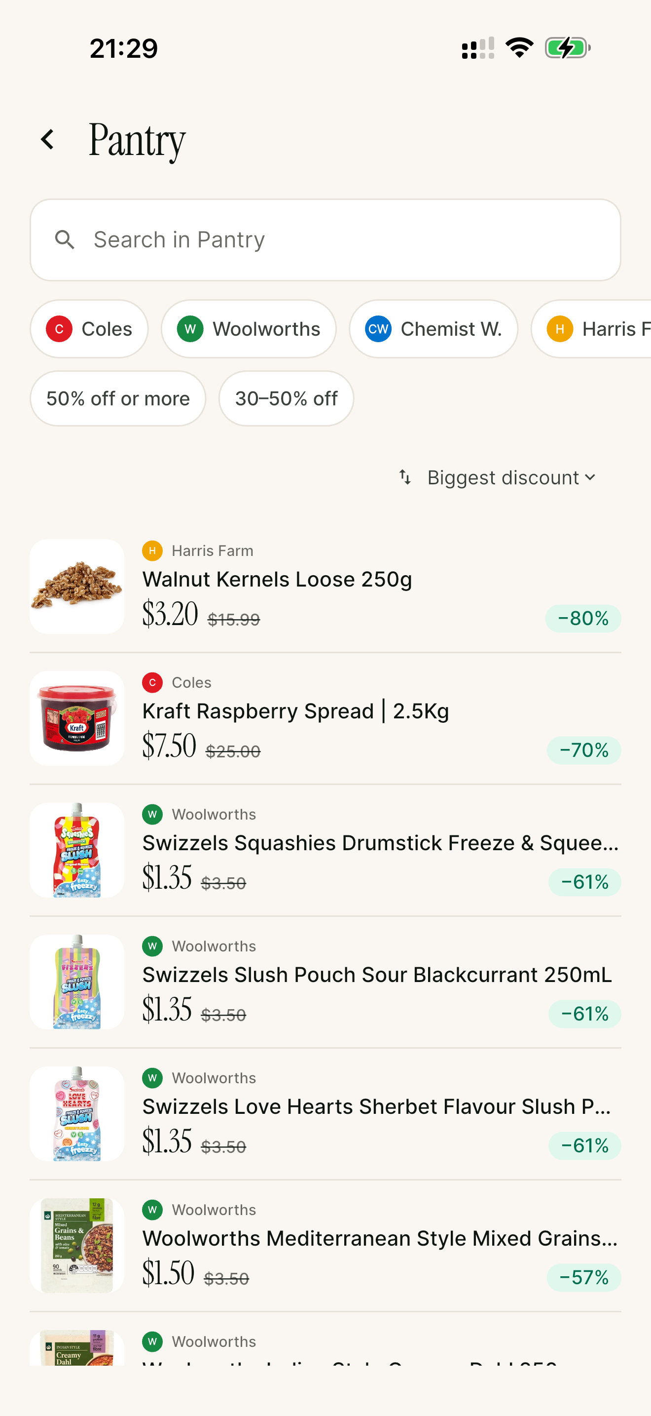 Halfy Pantry category showing 50%+ off deals across Coles, Woolworths, Chemist Warehouse and Harris Farm, sorted by biggest discount
